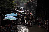 Thailand, Locals sell fruits, food and products at Damnoen Saduak floating market near Bangkok 